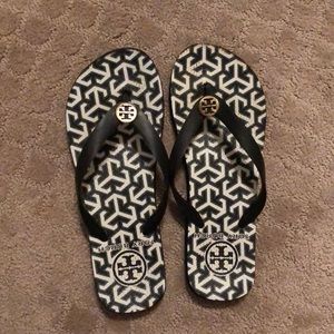 Black and white Tory Burch flip flops